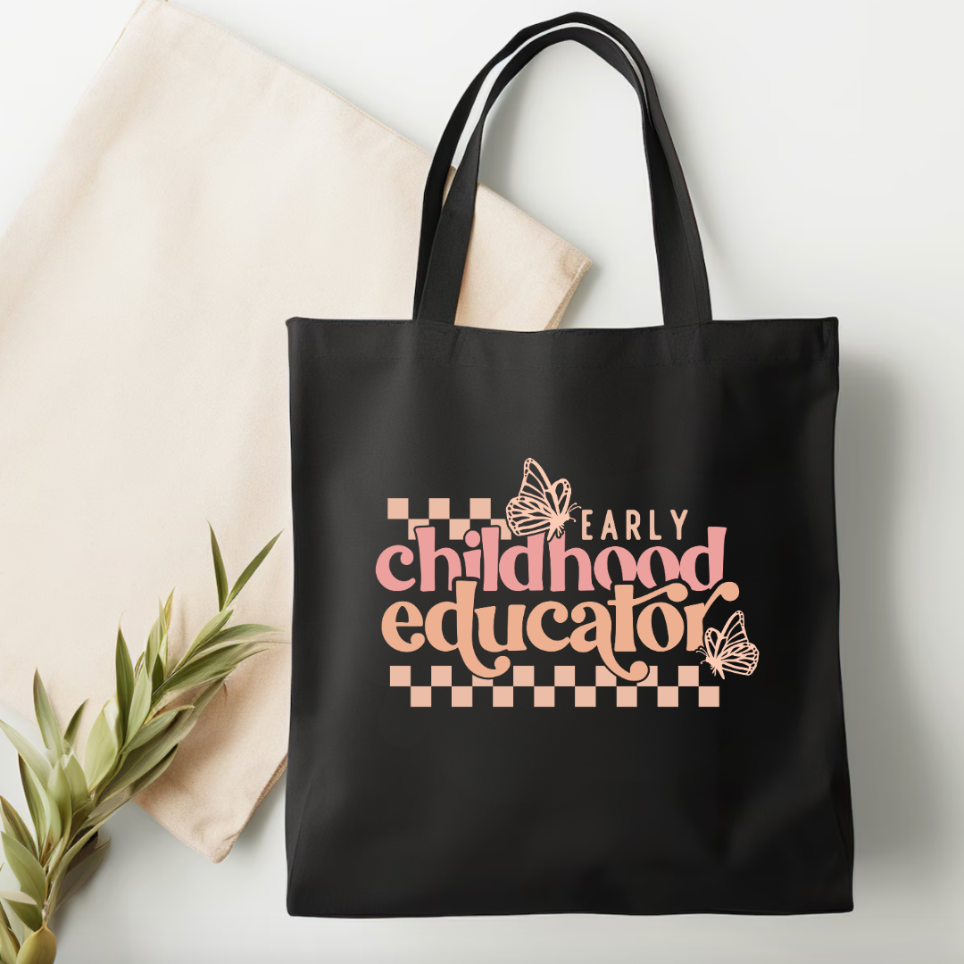 Black tote bag with 'Early Childhood Educator' text on a light background