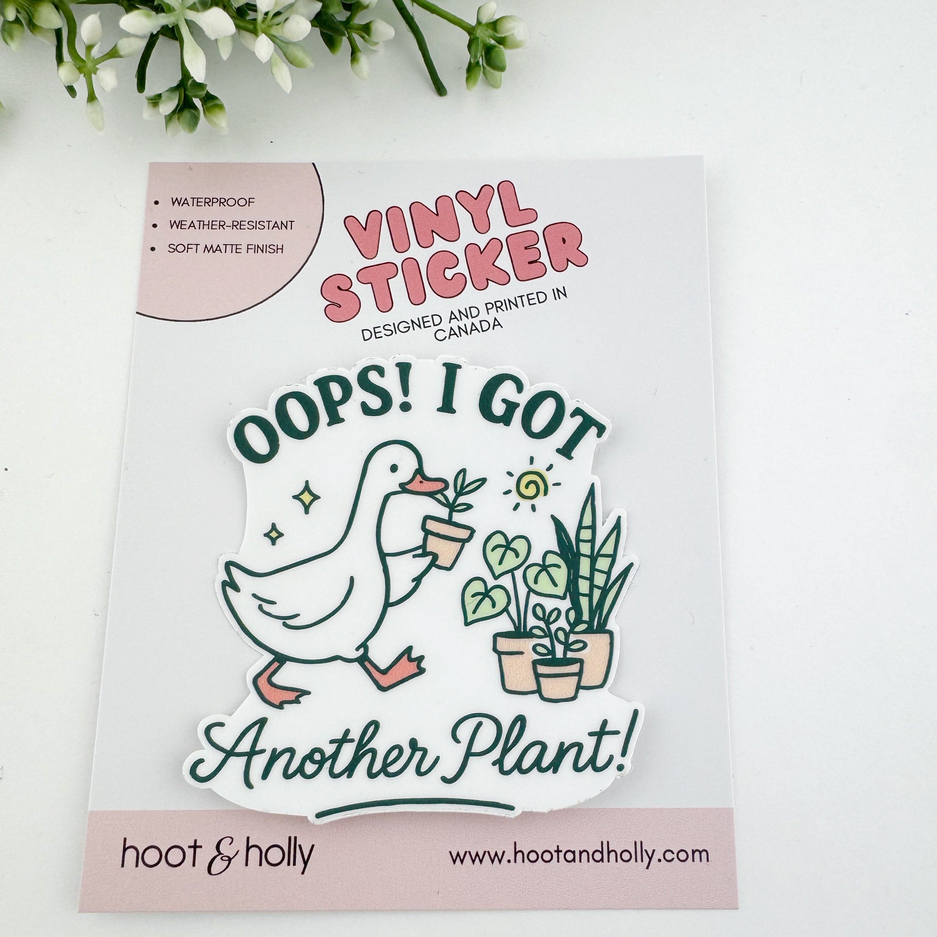 Vinyl sticker with a duck holding plants and text 'Oops! I got another plant!'