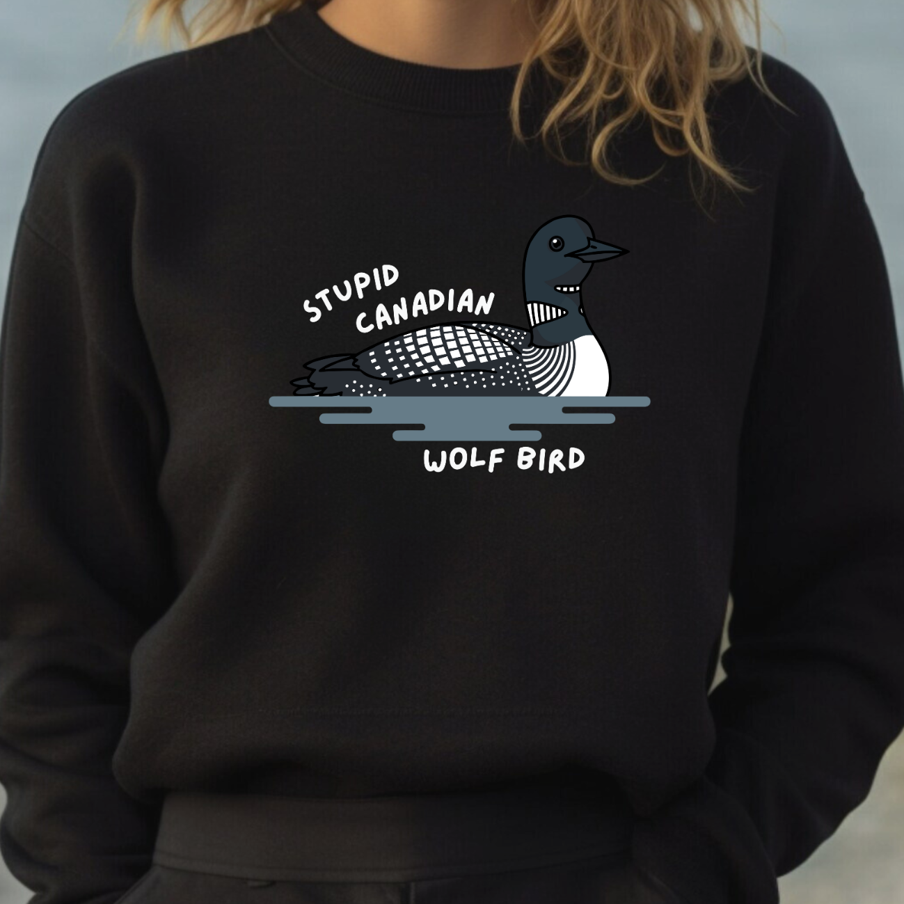 Black sweatshirt with a graphic of a bird "stupid Canadian wolf bird"