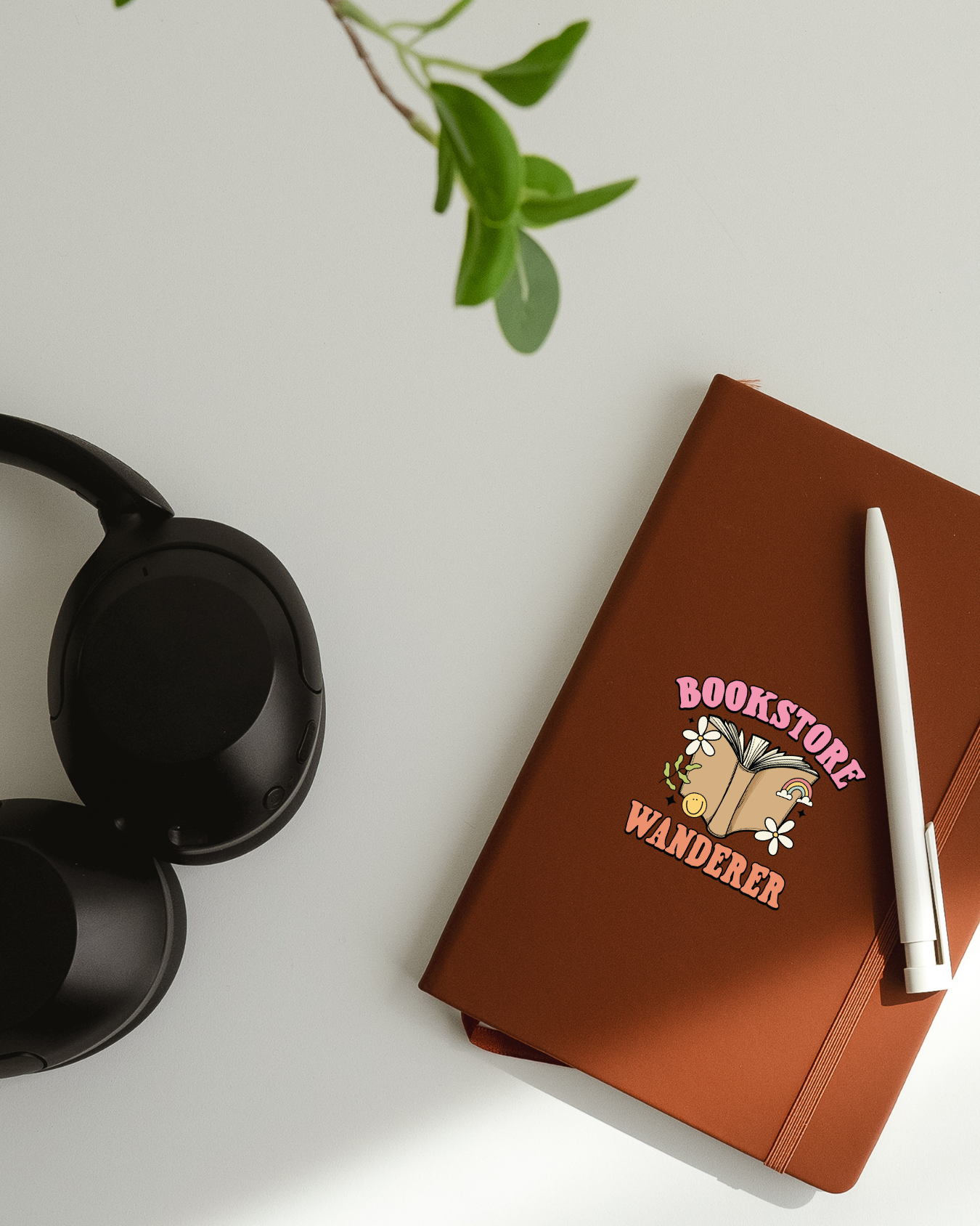  'Bookstore Wanderer vinyl sticker on notebook'