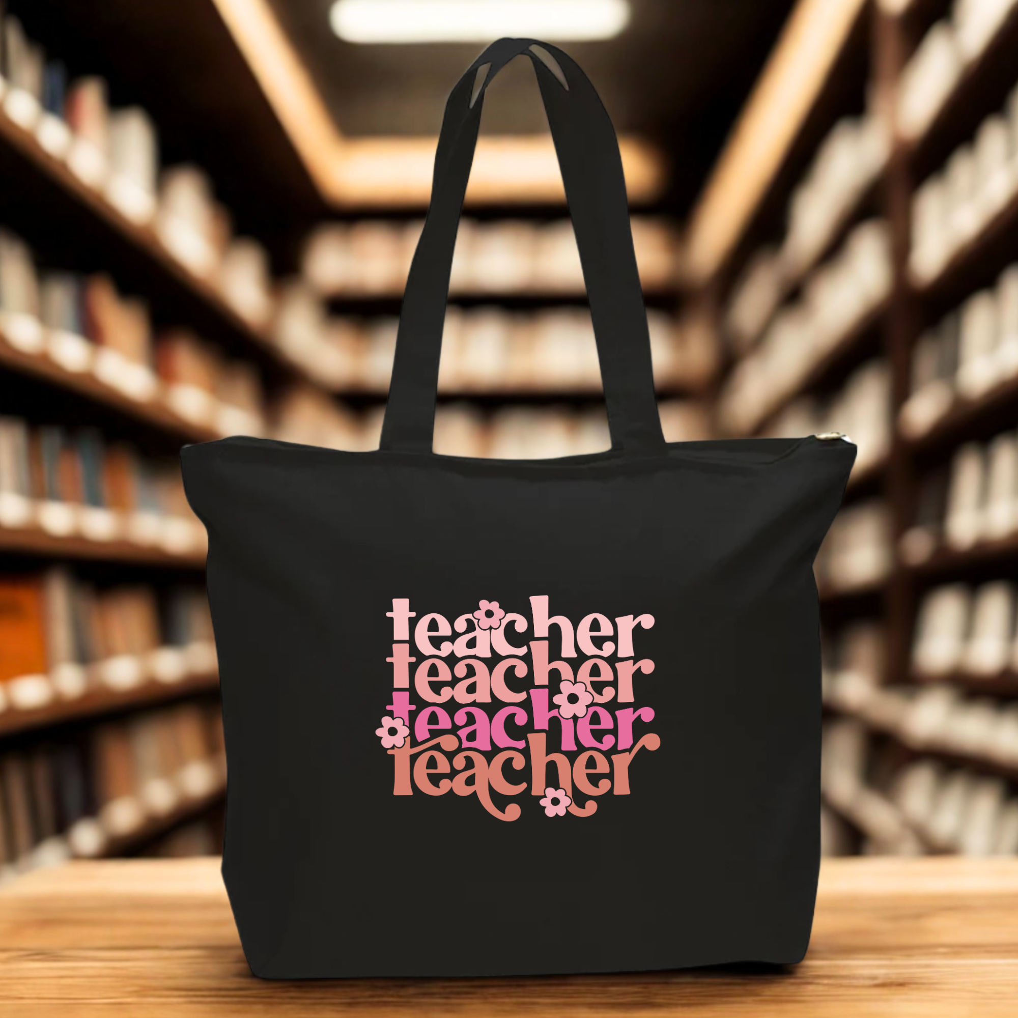 Black tote bag with 'teacher' text in various colors 